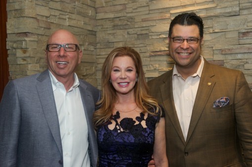 Dr. Franklin Rose and Cindi Rose,left, with party host Reuben Rolf. Photo by Herb Hochman